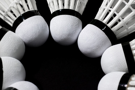 Shuttlecock in a badminton tournament on a black background.の写真素材