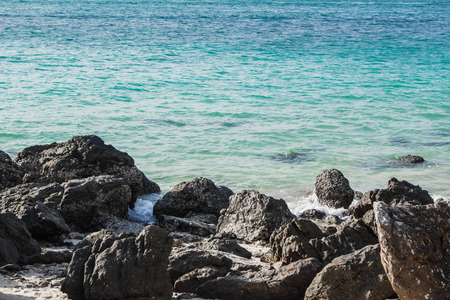 Rocks on the beach in the evening during the summer.の写真素材