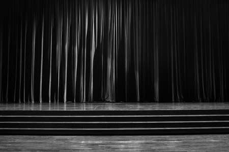 Black and white  curtains and the stage parquet with stairs in theater.の写真素材