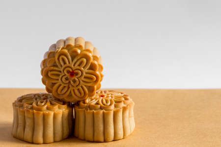 Mooncakes in the Mid autumn Festival. Mid autumn festival mooncake isolated on white and brown...