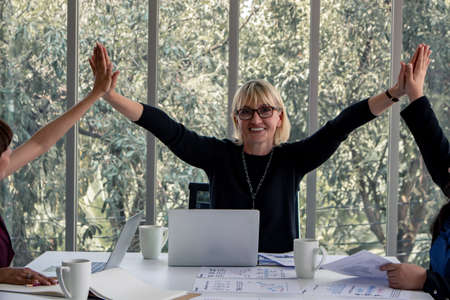 Concept of teamwork of business women in the meeting room. Business work successfully as a team.