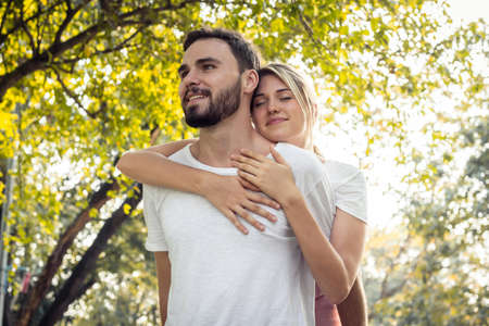 Teen couples show love to each other in the park. Couples exercise at the park in the morning. ...