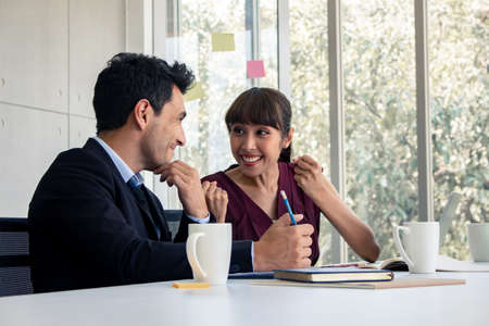 Business men and women glad signed a joint business agreement in meeting room. Concept business in meeting room.の写真素材
