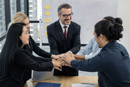 Business team showing unity with their hands together. Success business team concept. Business...