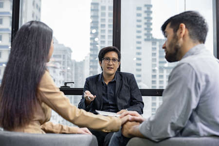 Husband and wife talking, help and giving support by psychiatrist. Mental health concept, couple...