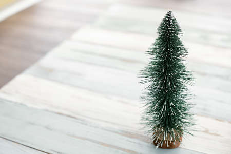Top view of Christmas composition with Christmas tree on wooden background and copy space. Accessories of Christmas and new year concept.の写真素材