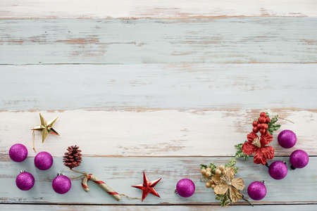Top view of Christmas composition with ball, star and toy on wooden background and copy space. Accessories of Christmas and new year concept.の写真素材