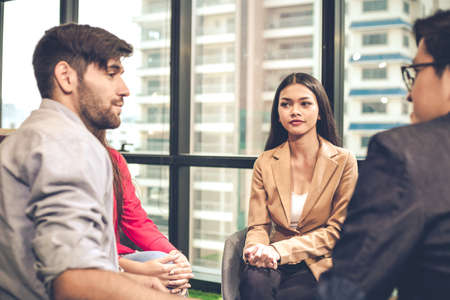 Mental health concept, group problematic young people talking with a guidance counselor about...