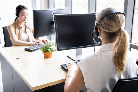 Group of diverse telemarketing customer service staff team in call center. Call center worker...