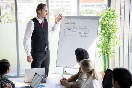 Meetings and consultations of business people in the company's meeting room. Conference to analyze and find the progress of the organization.の写真素材