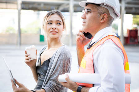 Engineers explained the project plan to the young woman employer, aware of the progress of the...