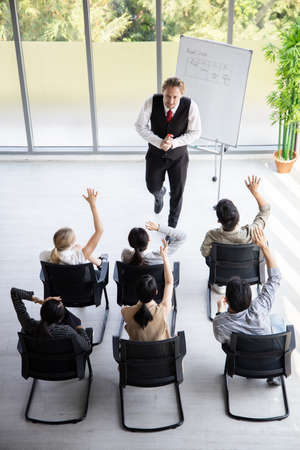 Top view of meetings and consultations of business people in the company's meeting room. Conference...