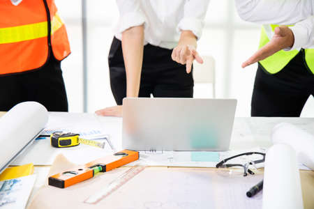 Team of engineers is discussing solutions to the problem of working together.の写真素材