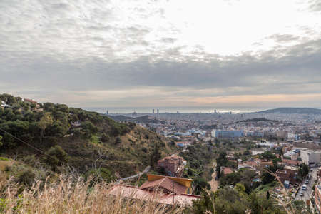 Panorama of Barcelona from Mount Tibidabo. Early morning in Barcelona. Landscape overlooking the city. View from the mountain to the city at dawn.の写真素材