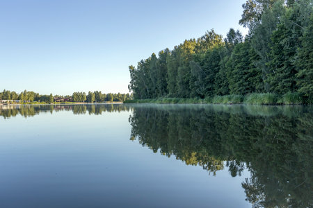 Boats at the pier. Early morning. Fog on the river. Beautiful sunrise in the summer by the river.の写真素材