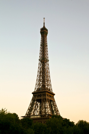Sunset on the Eiffel Tower, Paris, France  Eiffel Tower at dusk with some trees in the base, Paris, France の写真素材