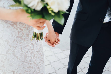 bride and groom holding handsの写真素材
