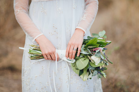 Close up of bride holding the wedding bouquetの写真素材
