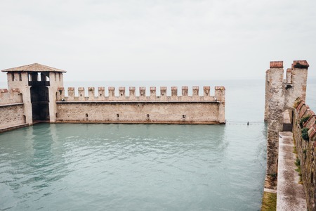 13th-century medieval stone Scaliger Castle (Castello Scaligero) on Lake Garda, Province of Veronaの写真素材