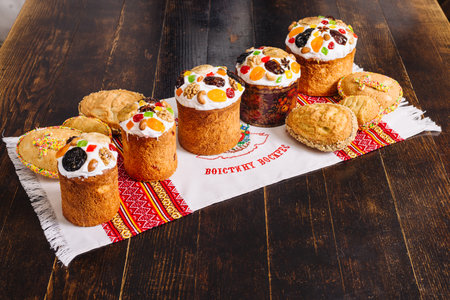 Traditional ukrainian easter Kulich cake (paskha) on a wooden desk on a towelの写真素材