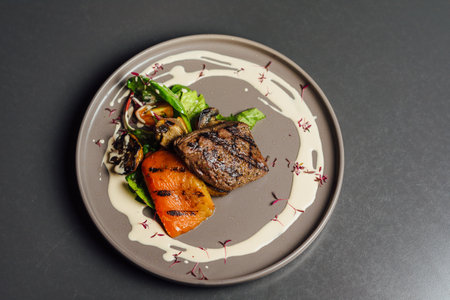 steak with vegetables on a plate in a restaurant. restaurant menu