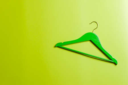 Multicolored hangers on a green background.の写真素材