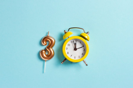 Composition with the number 3 and the clock in the form of 0 on a blue background, which means 30 years of independence of Ukraine.の写真素材