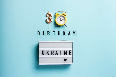 Composition in honor of the 30th Independence Day of Ukraine on a blue background.の写真素材