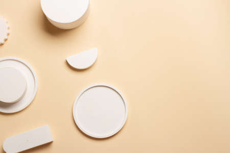 Composition of plaster decorations of different geometries on a delicate background.