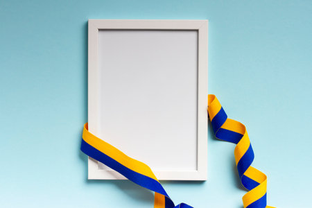 Composition on blue background with a frame with a space for the text in honor of Independence Day of Ukraine.の写真素材