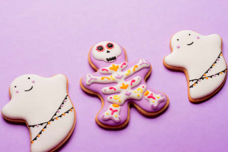 Homemade Halloween cookies, ghosts, flying mice on purple background.の写真素材