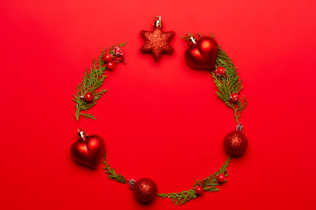 Christmas composition with decorations and ornametns on red background.の写真素材