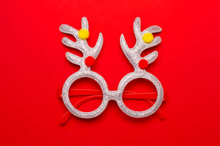 Christmas composition with ornaments on red background with space for text.の写真素材