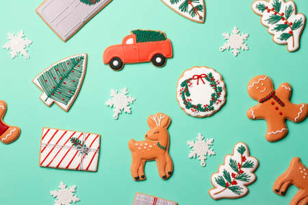 Christmas composition with decorations and cookies on a mint background.の写真素材