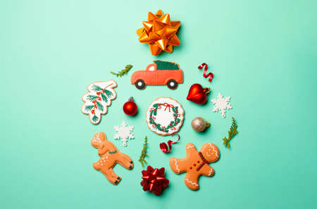 Christmas composition with decorations and cookies on a mint background.の写真素材