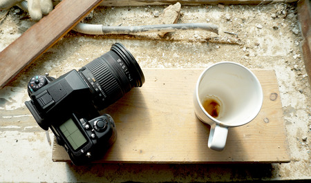 camera and coffee cup on siteの写真素材