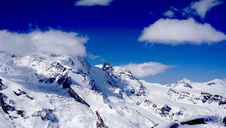 snow alps mountains and blue sky matterhorn zermatt switzerlandの写真素材