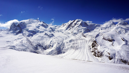 snow alps mountains and blue sky zermatt switzerlandの写真素材