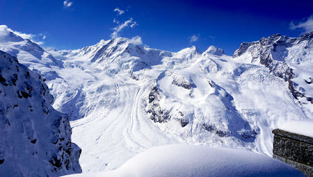 snow alps mountains landscape and blue sky zermatt switzerlandの写真素材