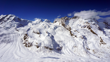 snow alps mountains view and blue sky zermatt switzerlandの写真素材