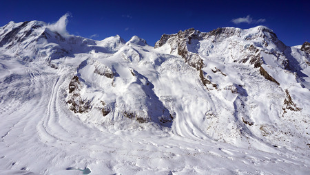 snow alps mountains and blue sky cloud zermatt switzerlandの写真素材