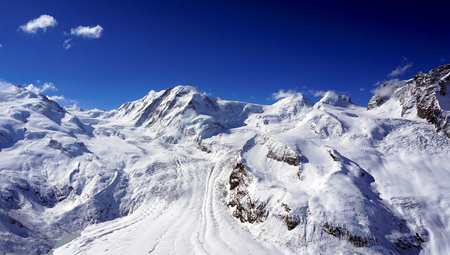 snow alps mountains with clouds zermatt switzerlandの写真素材