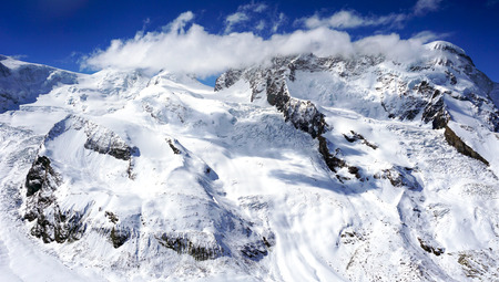 snow mountains with clouds zermatt switzerlandの写真素材