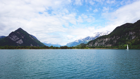 Scenery of Thun Lake and sail boat Interlaken Switzerlandの写真素材