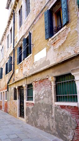 Alley with old building in Venice, Italyの写真素材
