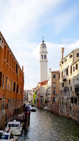Scene of canal and boat with ancient architecture in Venice, Italyの写真素材