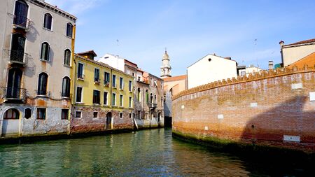 canal and ancient buildings in Venice, Italyの写真素材
