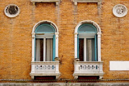Historical house brick building in old town city Venice, Italyの写真素材