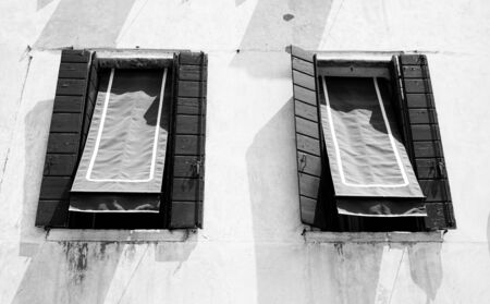 black and white two windows in Venice, Italyの写真素材