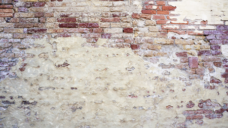 decay wall mixed with brick background horizontal in Venice, Italyの写真素材